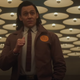 Tom Hiddleston's Loki points a thumb at himself in footage from Marvel's latest Disney+ show, Loki.